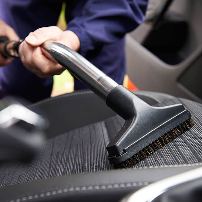 Vacuuming interior of a car